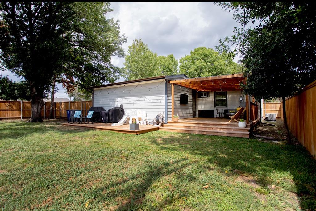 10879 Cassandra Way Dallas, TX 75228 - Photo 32 of 36 a view of a house with a backyard porch and sitting area