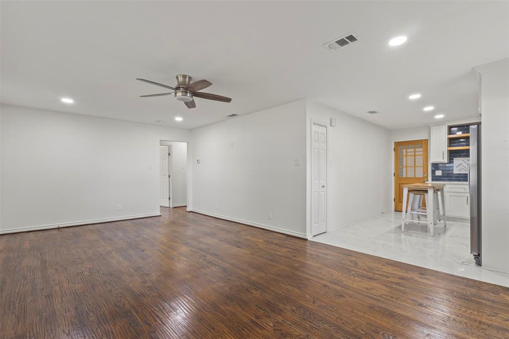 10879 Cassandra Way Dallas, TX 75228 - Photo 10 of 36 a view of work space with wooden floor and a ceiling fan
