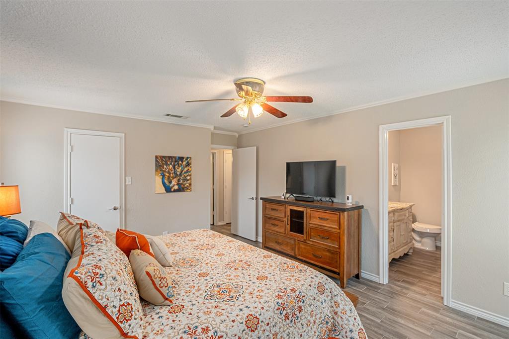 1102 Mill Run Road Athens, TX 75751 - Photo 19 of 35 a bedroom with a bed and a flat screen tv