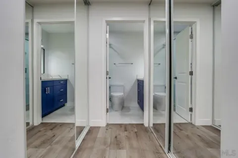 a view of a bathroom with a glass door shower