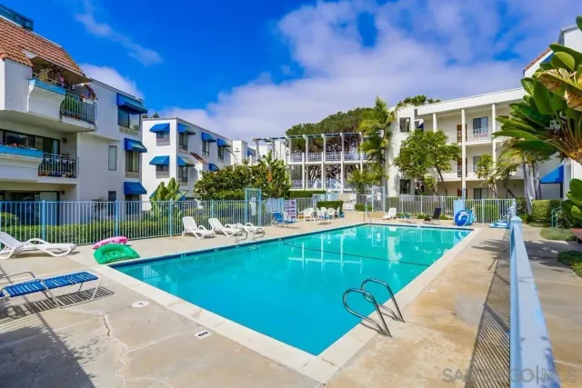 a view of a swimming pool with a patio