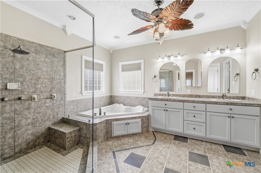 1118 East Maxwell Ditch Road Port Lavaca, TX 77979 - Photo 21 of 36 a spacious bathroom with a double vanity sink mirror and
