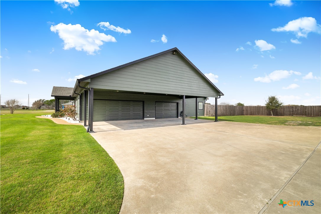 1118 East Maxwell Ditch Road Port Lavaca, TX 77979 - Photo 4 of 36 a house view with a garden space