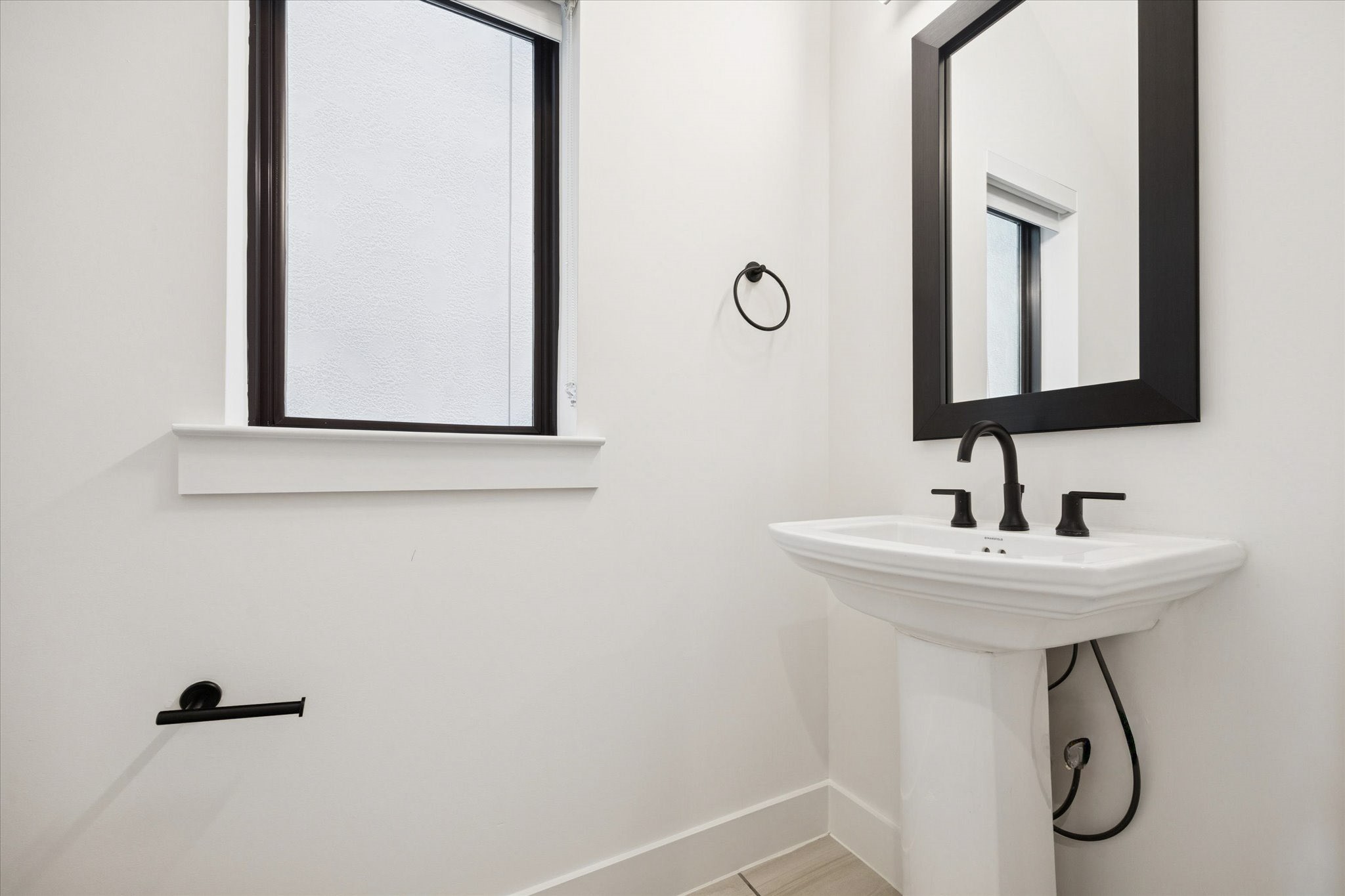 1739 Ojeman Point Lane Houston, TX 77055 - Photo 15 of 35 Powder room conveniently located off the main living area.