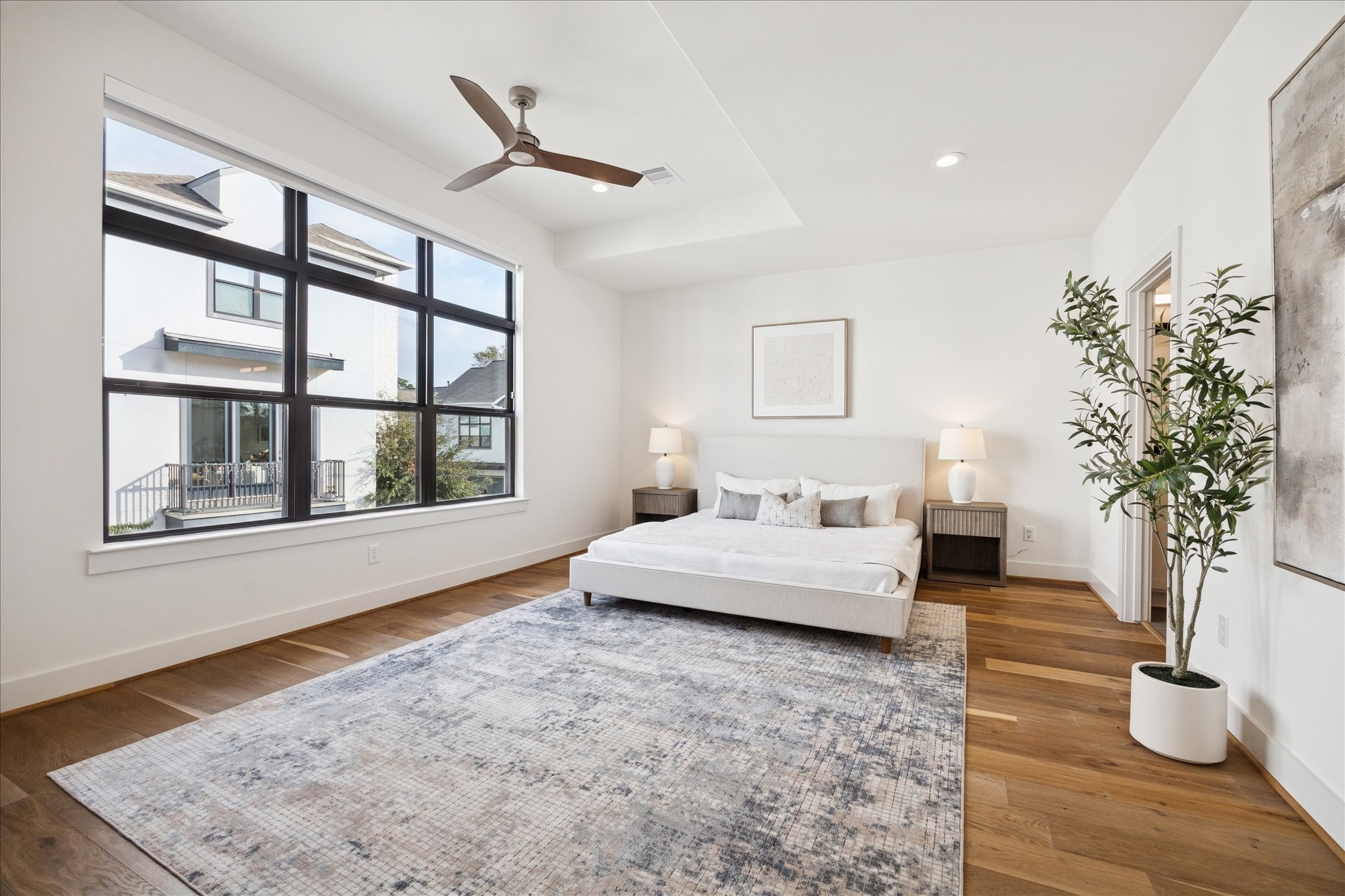 1739 Ojeman Point Lane Houston, TX 77055 - Photo 18 of 35 The second-floor primary suite offers abundant natural light, expansive windows, and a peaceful retreat with an ensuite bath.