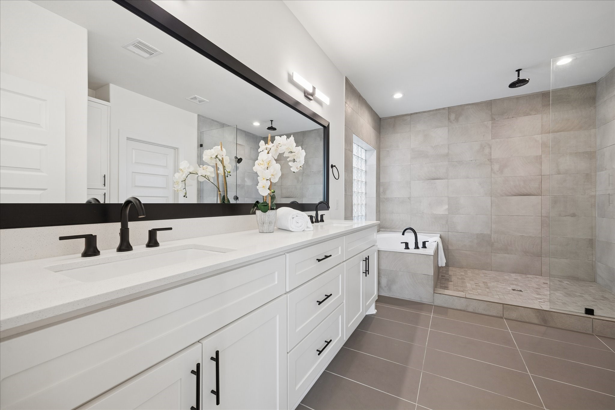 1739 Ojeman Point Lane Houston, TX 77055 - Photo 19 of 35 Elegant finishes and a thoughtful layout create a high-end, spa-inspired experience.