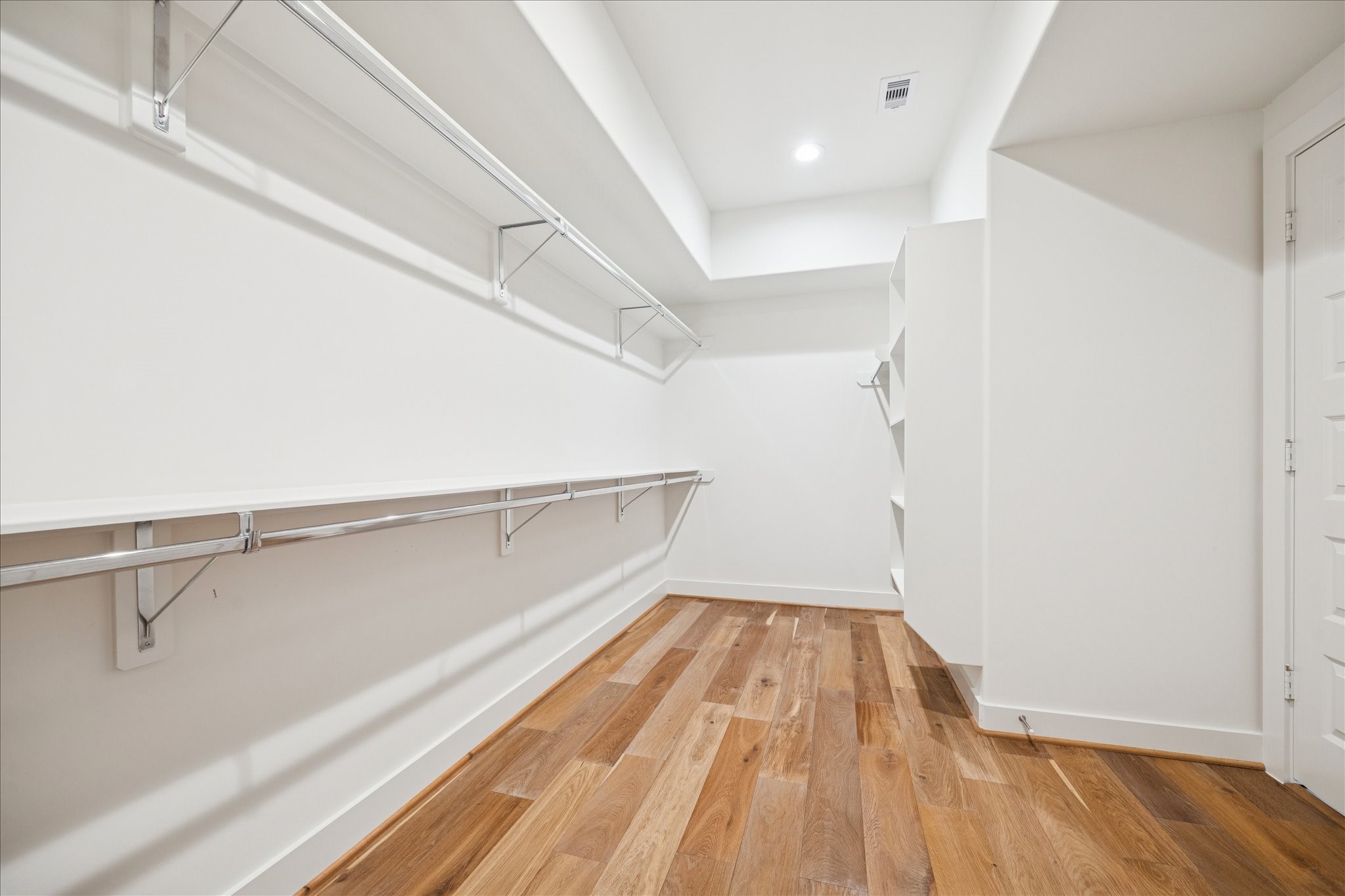 1739 Ojeman Point Lane Houston, TX 77055 - Photo 22 of 35 Additional side of the walk-in closet featuring custom built-in shelving and storage.