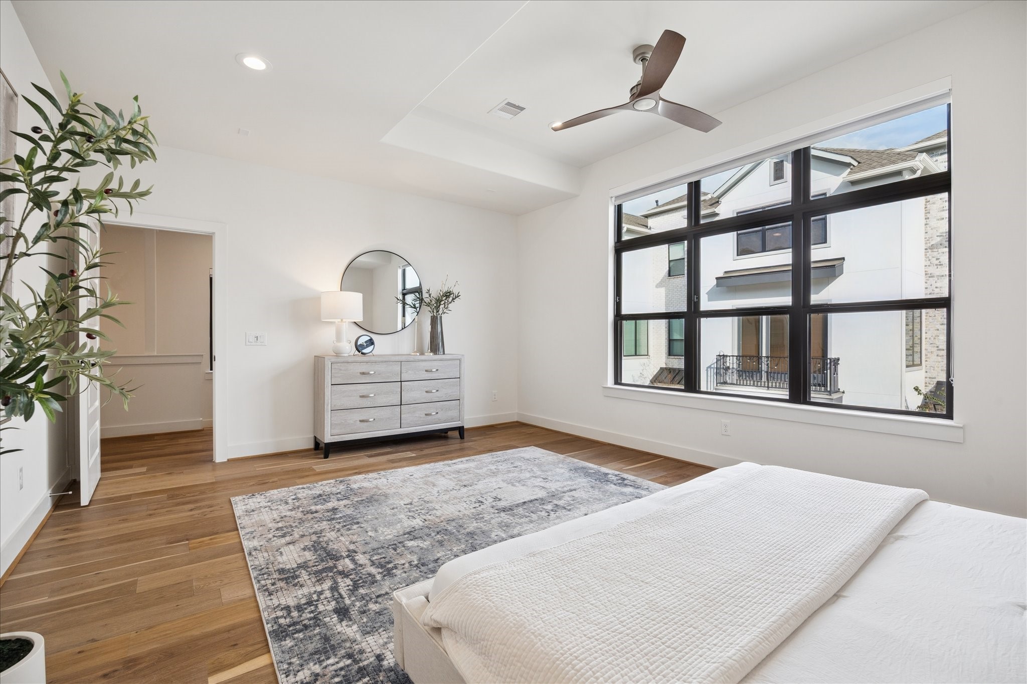 1739 Ojeman Point Lane Houston, TX 77055 - Photo 23 of 35 A spacious primary bedroom with a tray ceiling creates an airy retreat, conveniently located on the second floor.