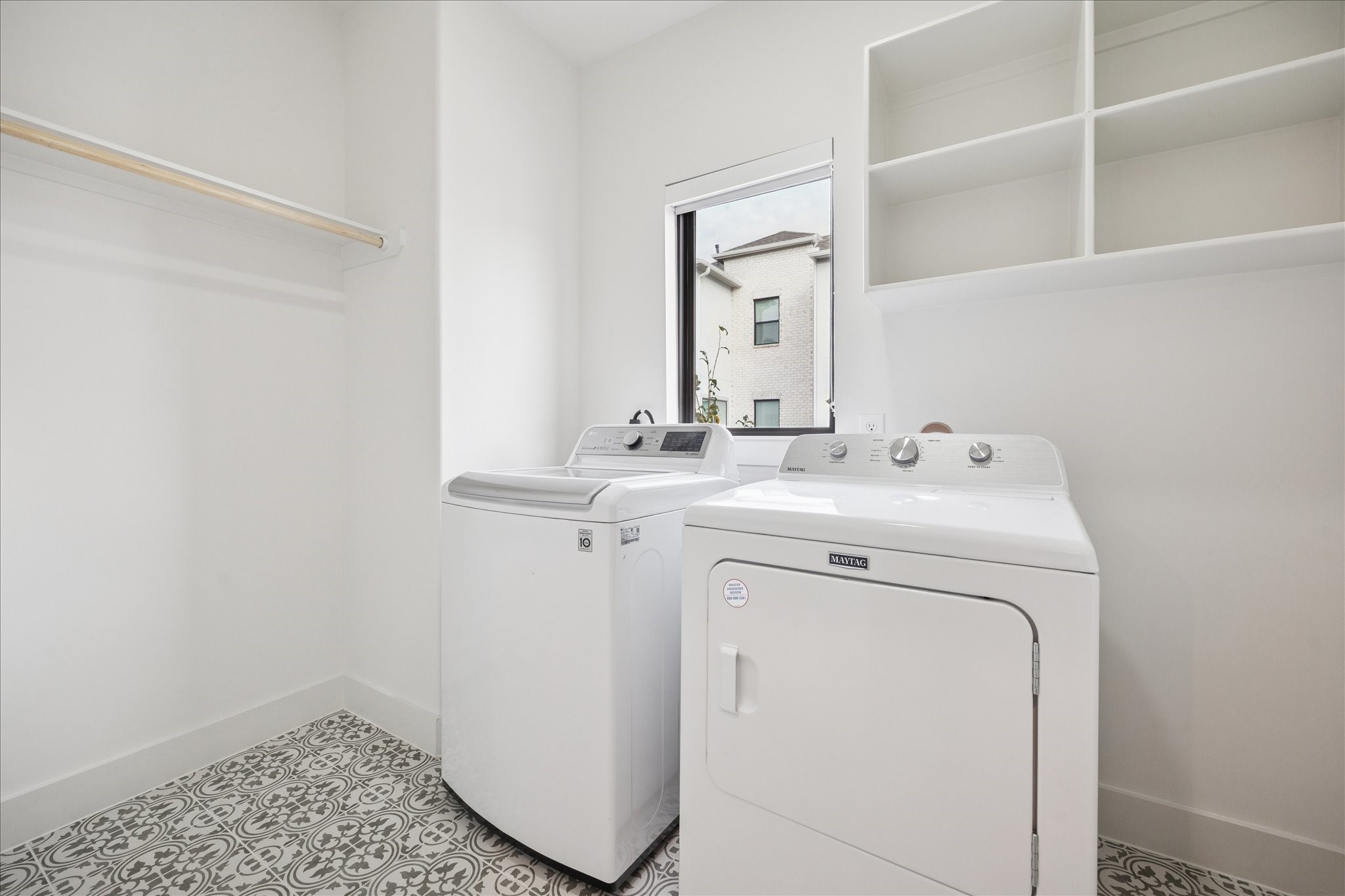 1739 Ojeman Point Lane Houston, TX 77055 - Photo 28 of 35 Conveniently located on the second floor, the utility room provides ample space with storage and hanging options.