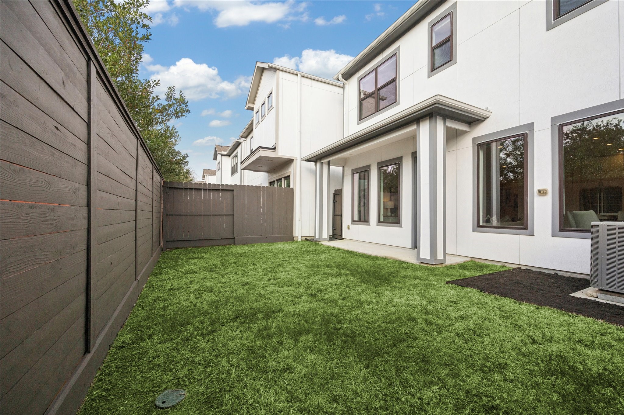 1739 Ojeman Point Lane Houston, TX 77055 - Photo 3 of 35 Private, fenced backyard with covered patio. Ideal for outdoor lounging and entertaining.