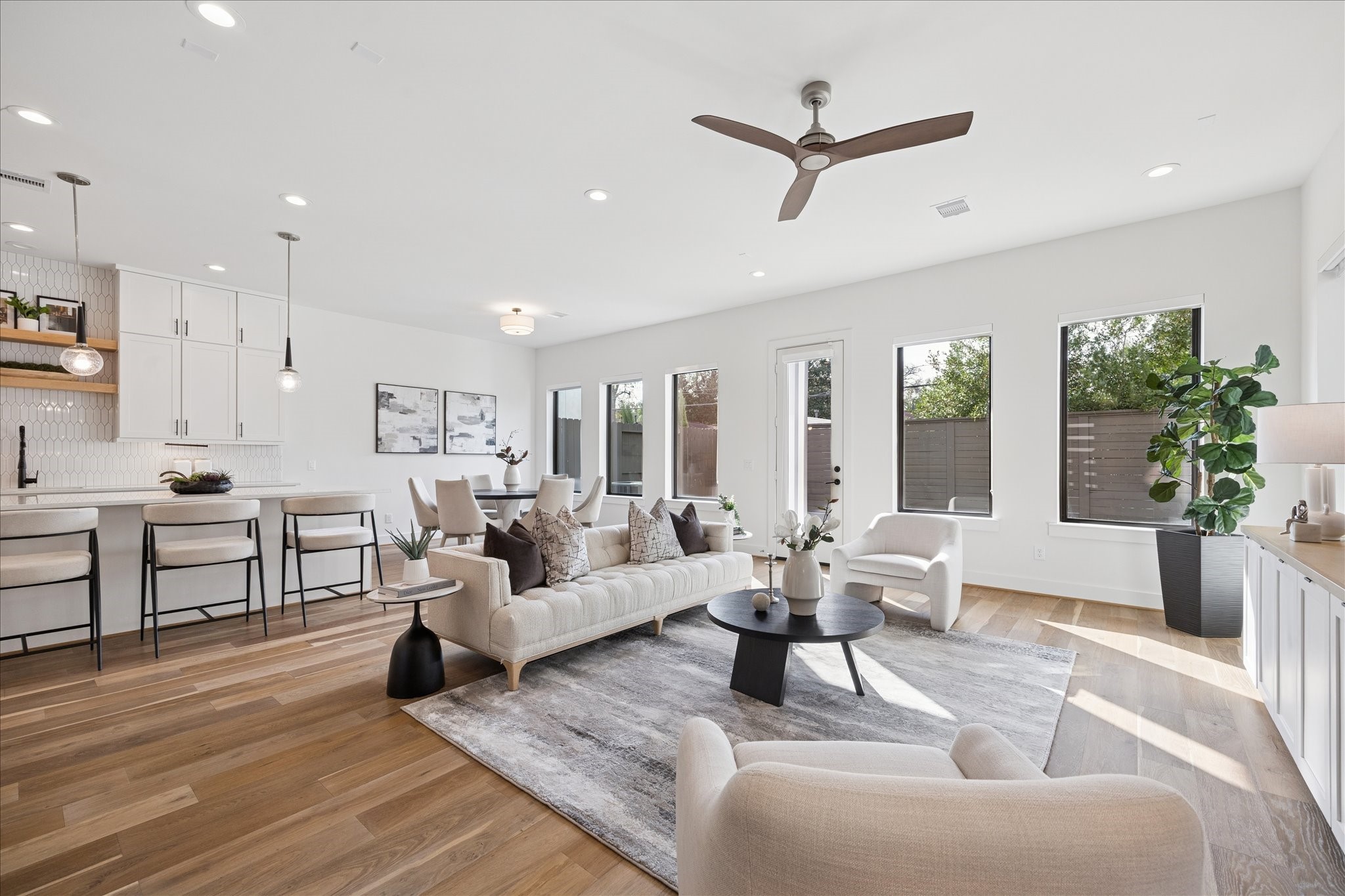 1739 Ojeman Point Lane Houston, TX 77055 - Photo 6 of 35 Fresh interior paint and French oak wood flooring create a warm, elevated feel throughout the home, complemented by blackout window shades.