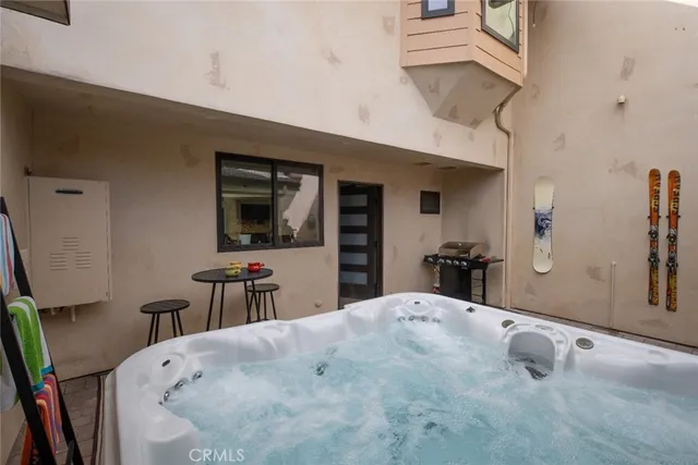a view of a terrace with dining table and chairs