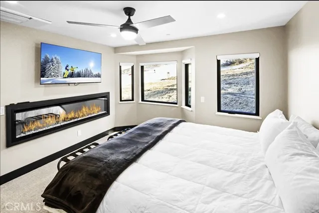 a bathroom with a sink mirror and shower