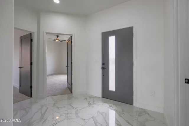 an empty room with closet and a bathroom