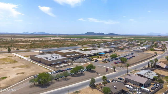 a view of a field with an ocean