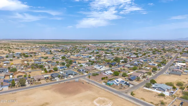 an aerial view of residential building and ocean