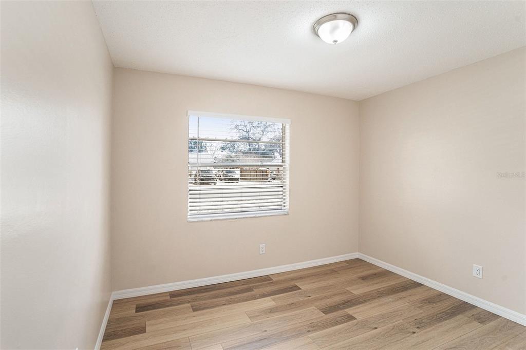 2527 Ridge Top Way Valrico, FL 33594 - Photo 17 of 29 a view of an empty room with wooden floor and a window