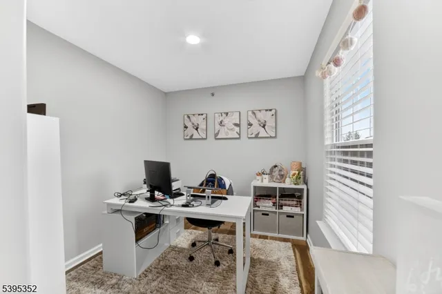 a view of a workspace with furniture