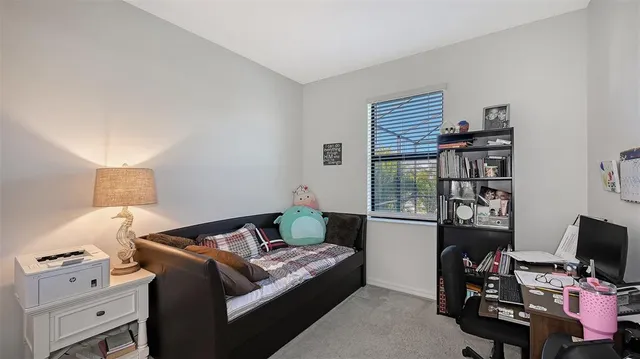 a bedroom with a bed and a tv