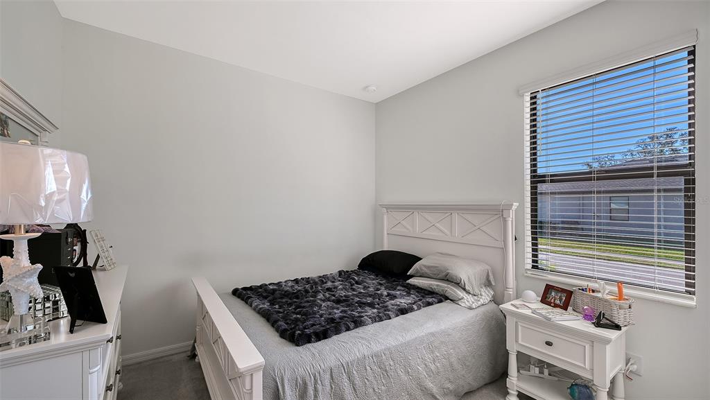 19625 Fishhawk Trail Venice, FL 34293 - Photo 18 of 38 a bedroom with a bed and a window