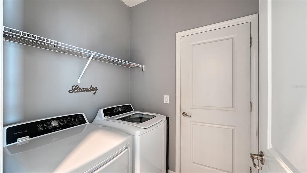 19625 Fishhawk Trail Venice, FL 34293 - Photo 20 of 38 a utility room with dryer and washer