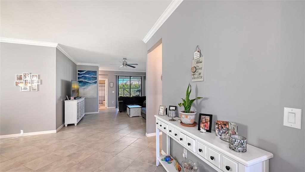 19625 Fishhawk Trail Venice, FL 34293 - Photo 4 of 38 a room with furniture and a potted plant