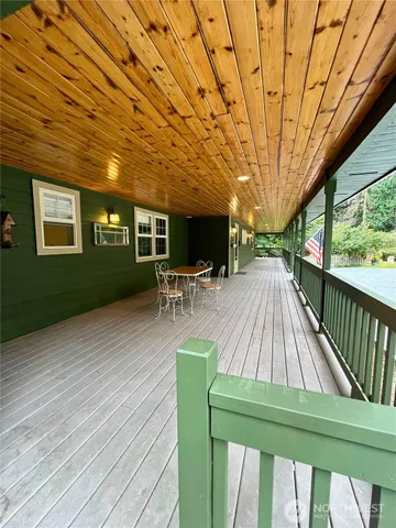 a view of a house with swimming pool and yard