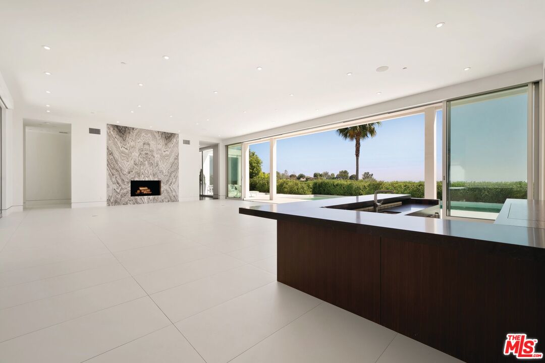 1115 Wallace Ridge Beverly Hills, CA 90210 - Photo 2 of 8 a large kitchen with a large window and a counter space