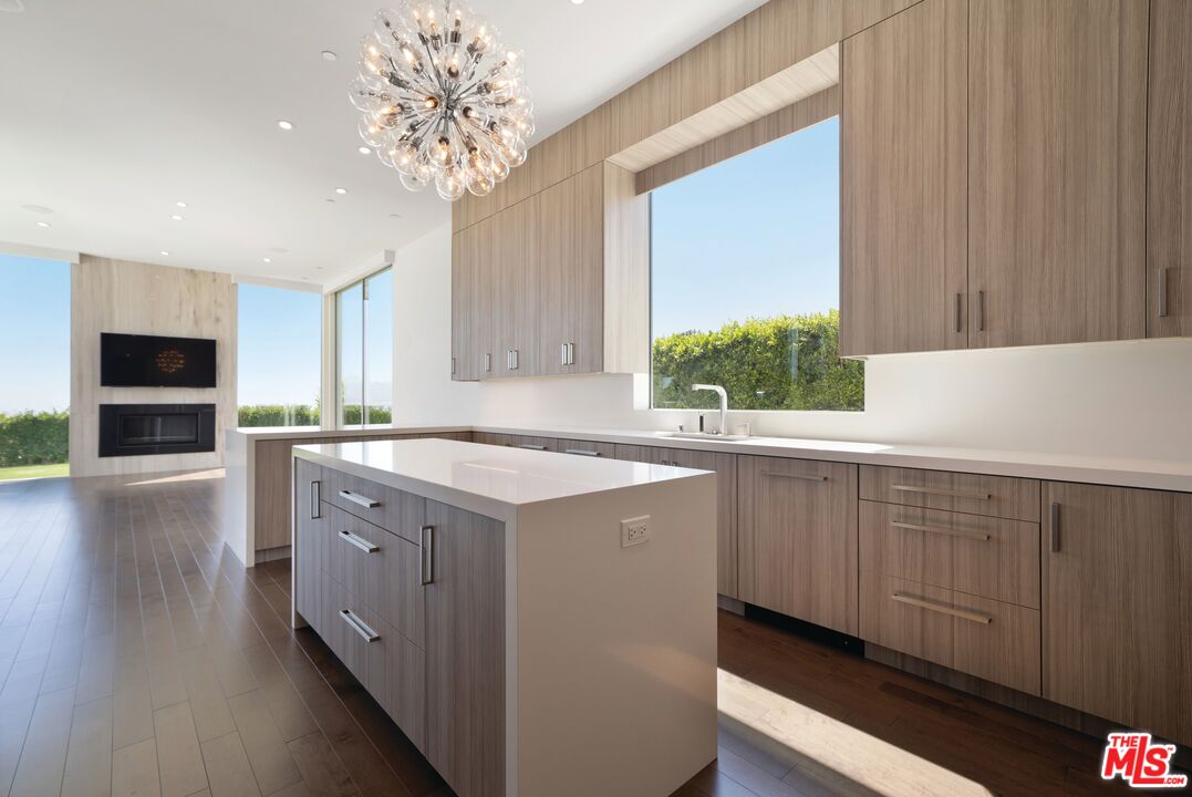 1115 Wallace Ridge Beverly Hills, CA 90210 - Photo 6 of 8 a kitchen with a sink cabinets and window