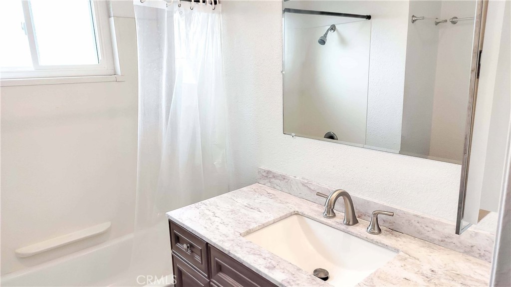 1724 Crofton Lane Escondido, CA 92027 - Photo 10 of 22 a bathroom with a sink and a mirror