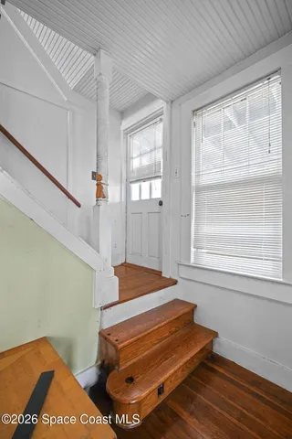 a backyard of a house with wooden floor