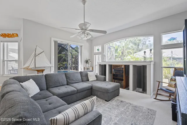 a living room with furniture and a large window
