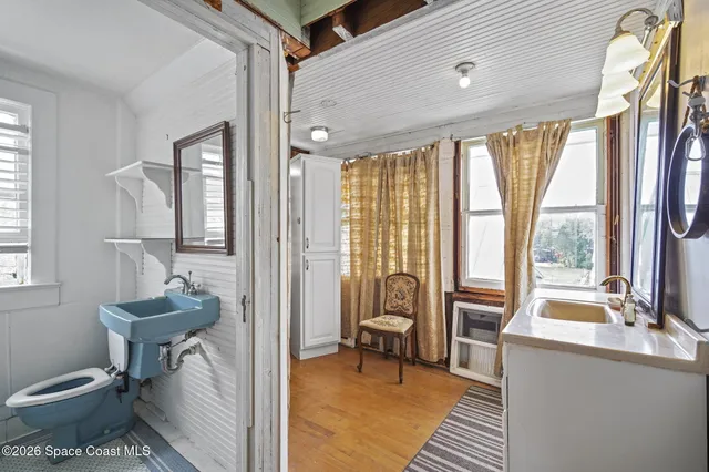 a bathroom with a sink toilet and a tub