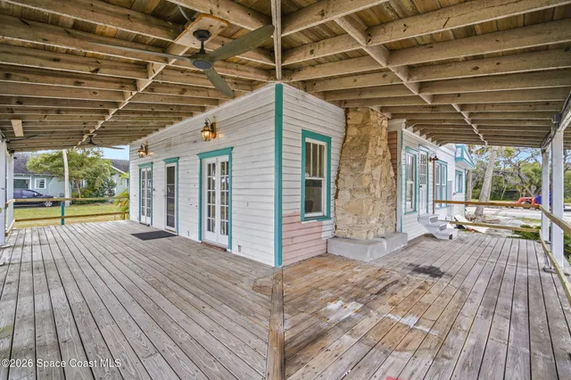 a view of porch with wooden floor