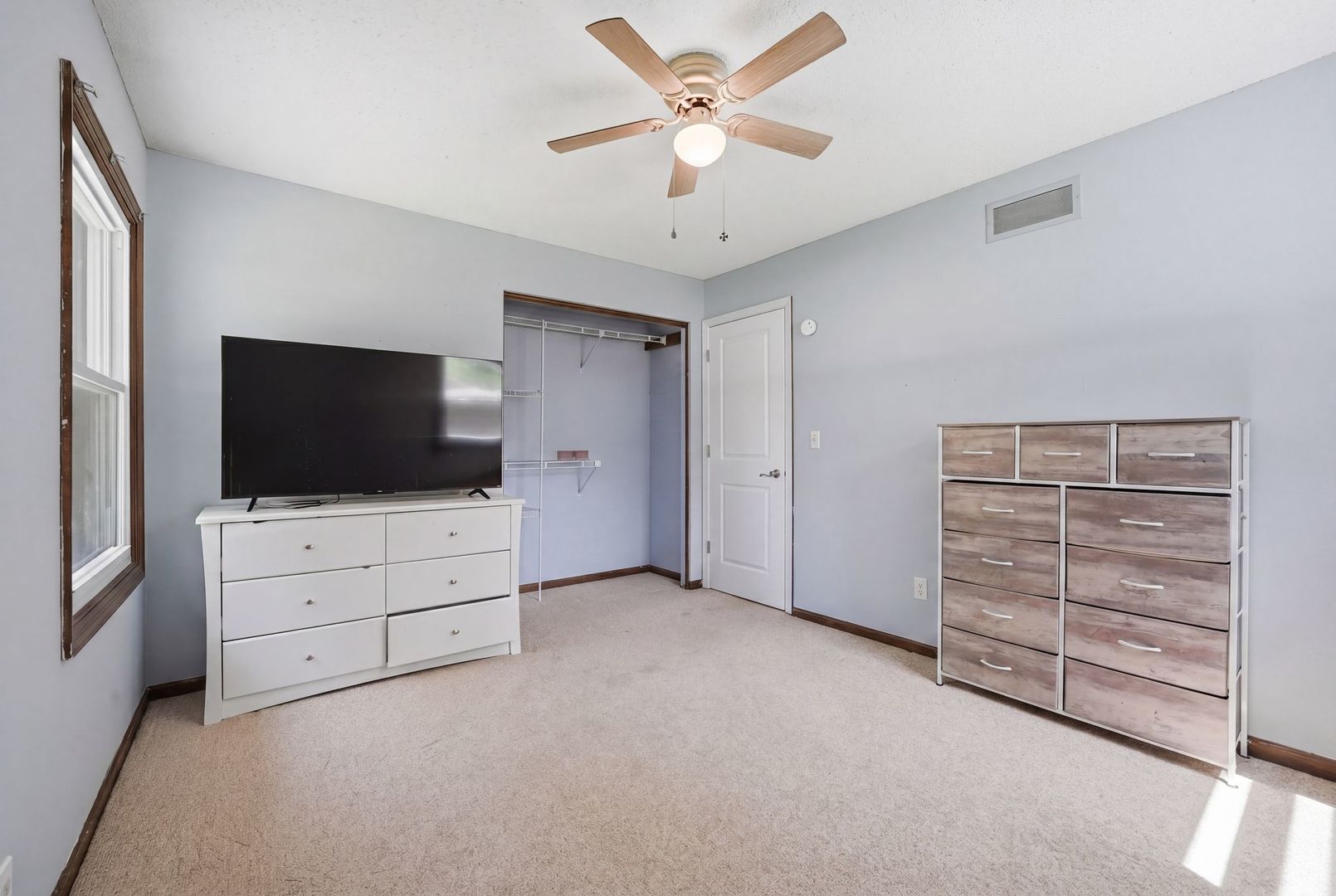 5645 Beebe Drive Rochelle, IL 61068 - Photo 21 of 43 a view of room with cabinet flat screen tv and cabinets