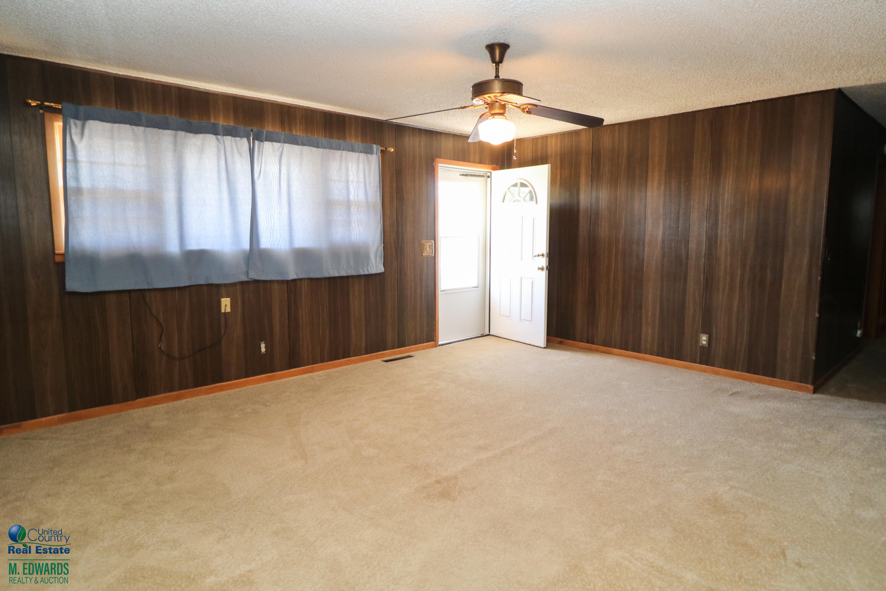404 Wilson Street Sudan, TX 79371 - Photo 2 of 10 a view of an empty room with a window