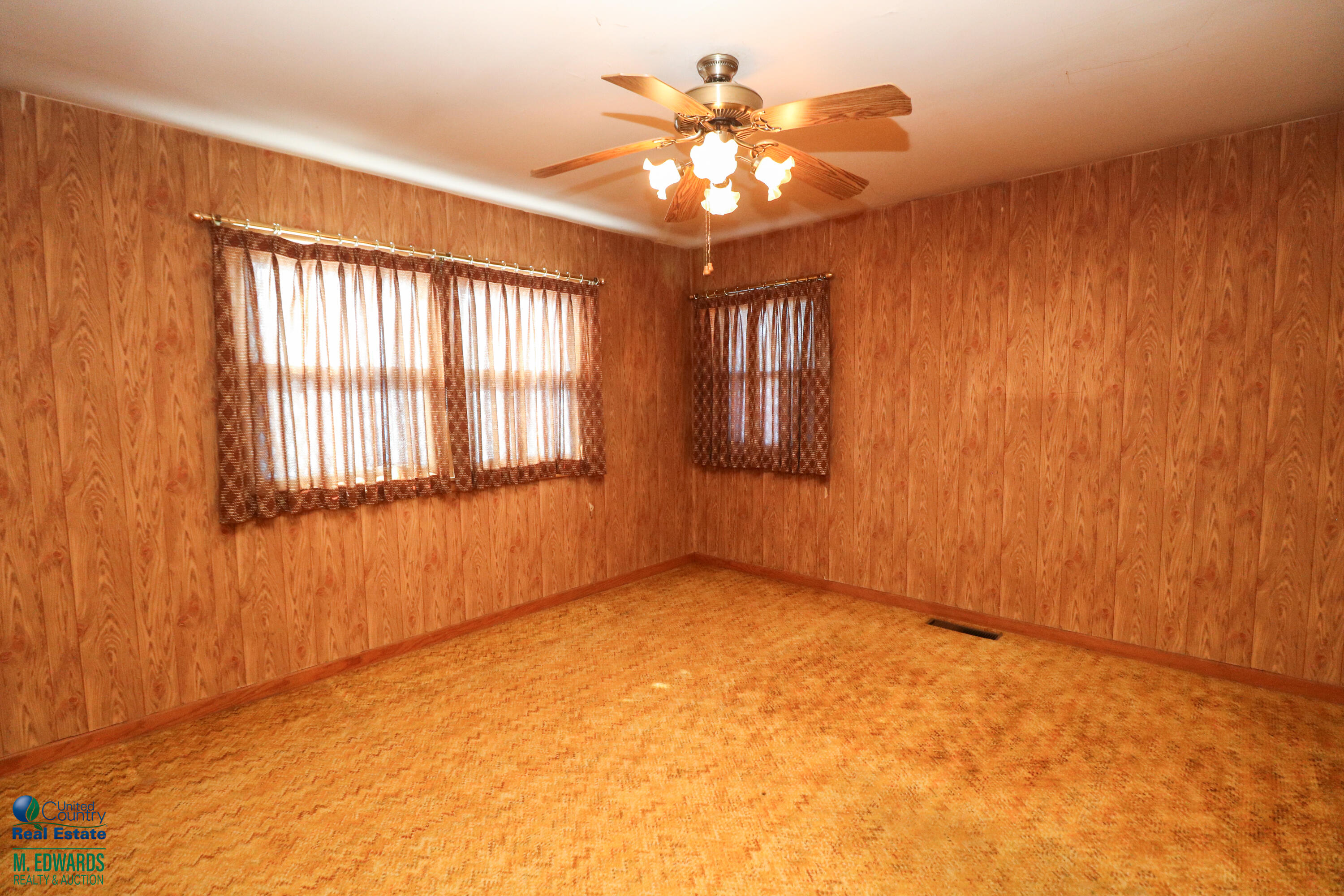 404 Wilson Street Sudan, TX 79371 - Photo 8 of 10 wooden floor in an empty room with a window