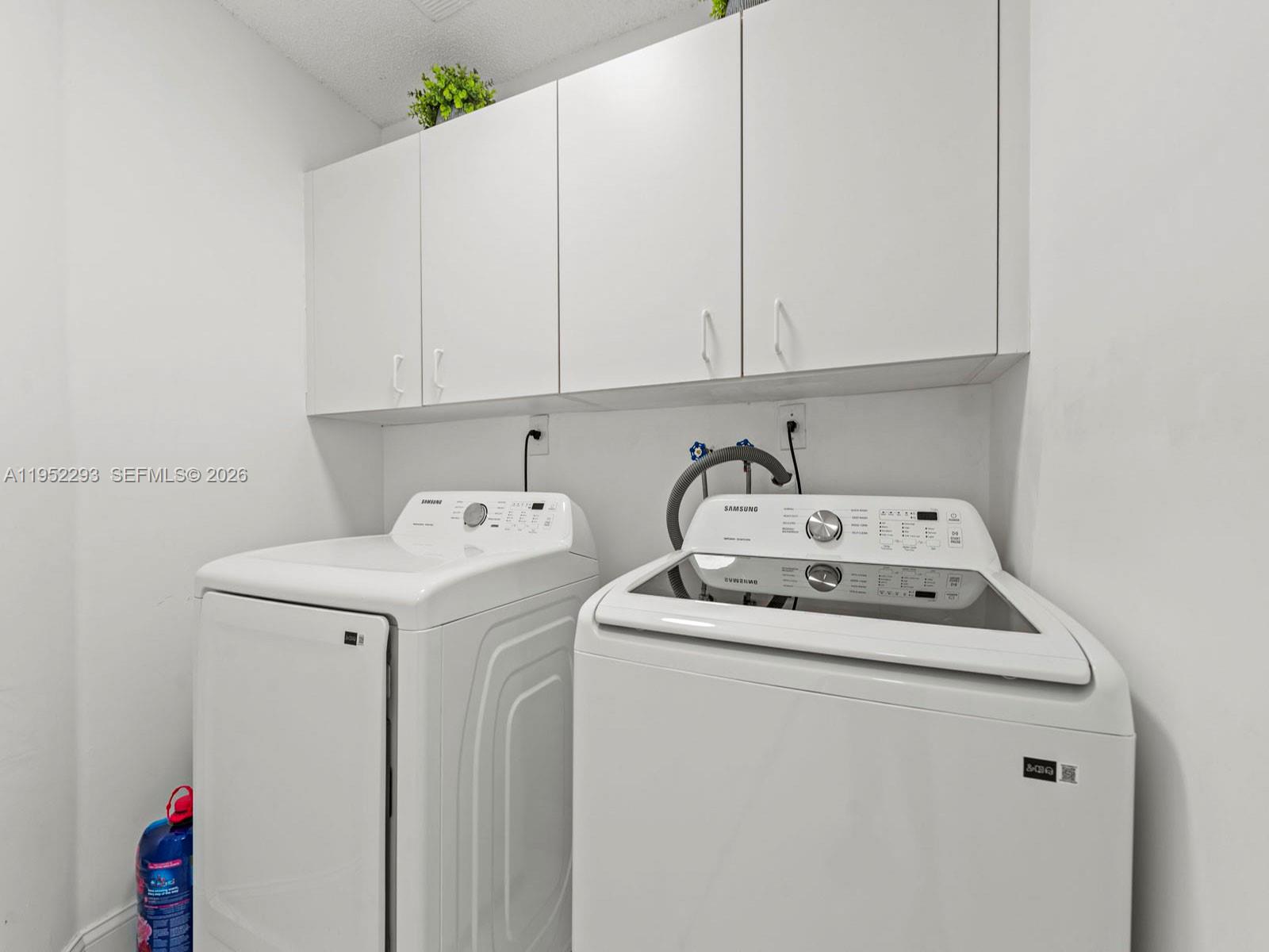 15626 Southwest 100th Terrace Miami, FL 33196 - Photo 17 of 30 a utility room with dryer and washer