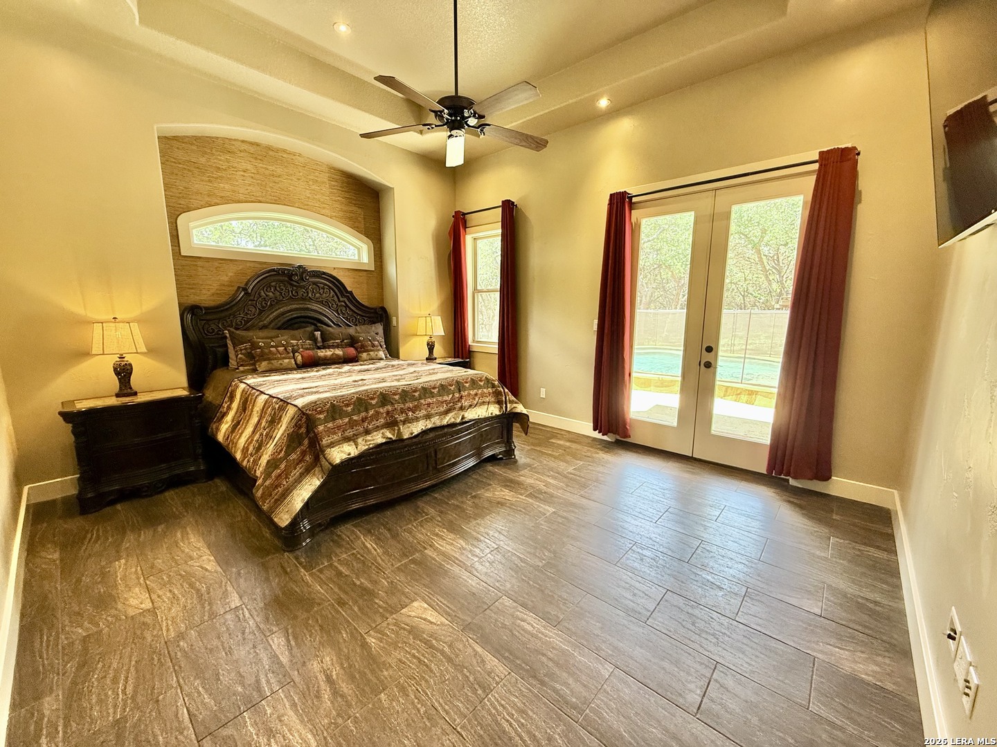 757 Copper Rim Spring Branch, TX 78070 - Photo 25 of 50 a bedroom with a bed and a chandelier