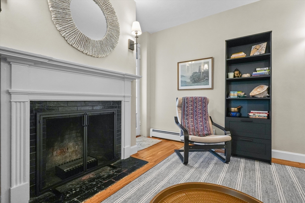 201 Humphrey Street, Unit 2 Marblehead, MA 01945 - Photo 11 of 31 a living room with furniture and a fireplace