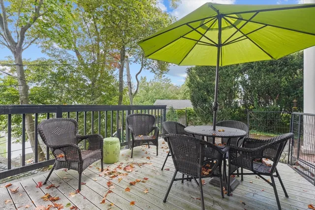 a view of a patio on the deck and a backyard
