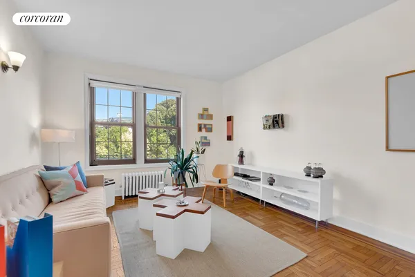 a living room with furniture and a window