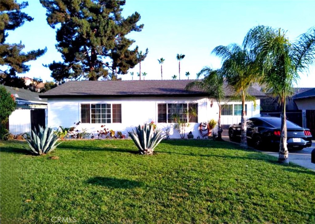 9778 Sharon Avenue Riverside, CA 92503 - Photo 1 of 19 a front view of a house with garden