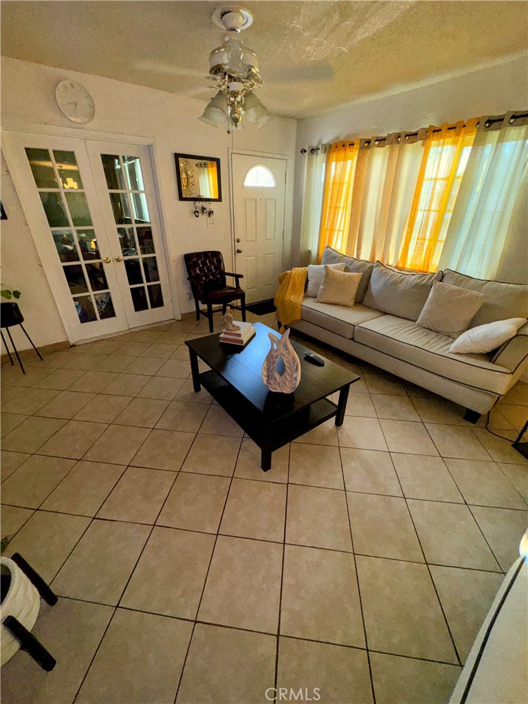 9778 Sharon Avenue Riverside, CA 92503 - Photo 12 of 19 a living room with furniture and a flat screen tv