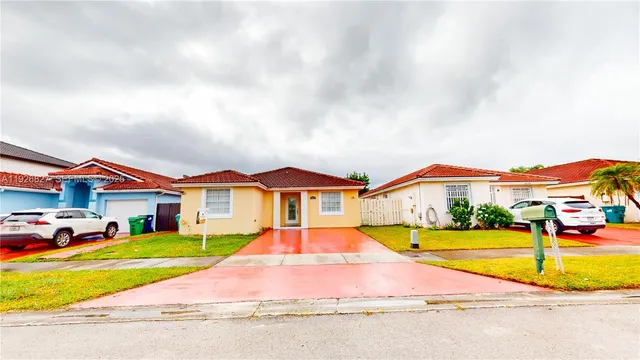 a house with swimming pool in front of it