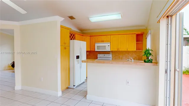 a view of a hallway with wooden floor and a livingroom view