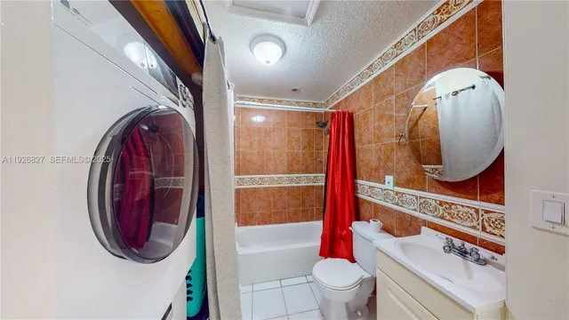 a bathroom with a toilet and a mirror