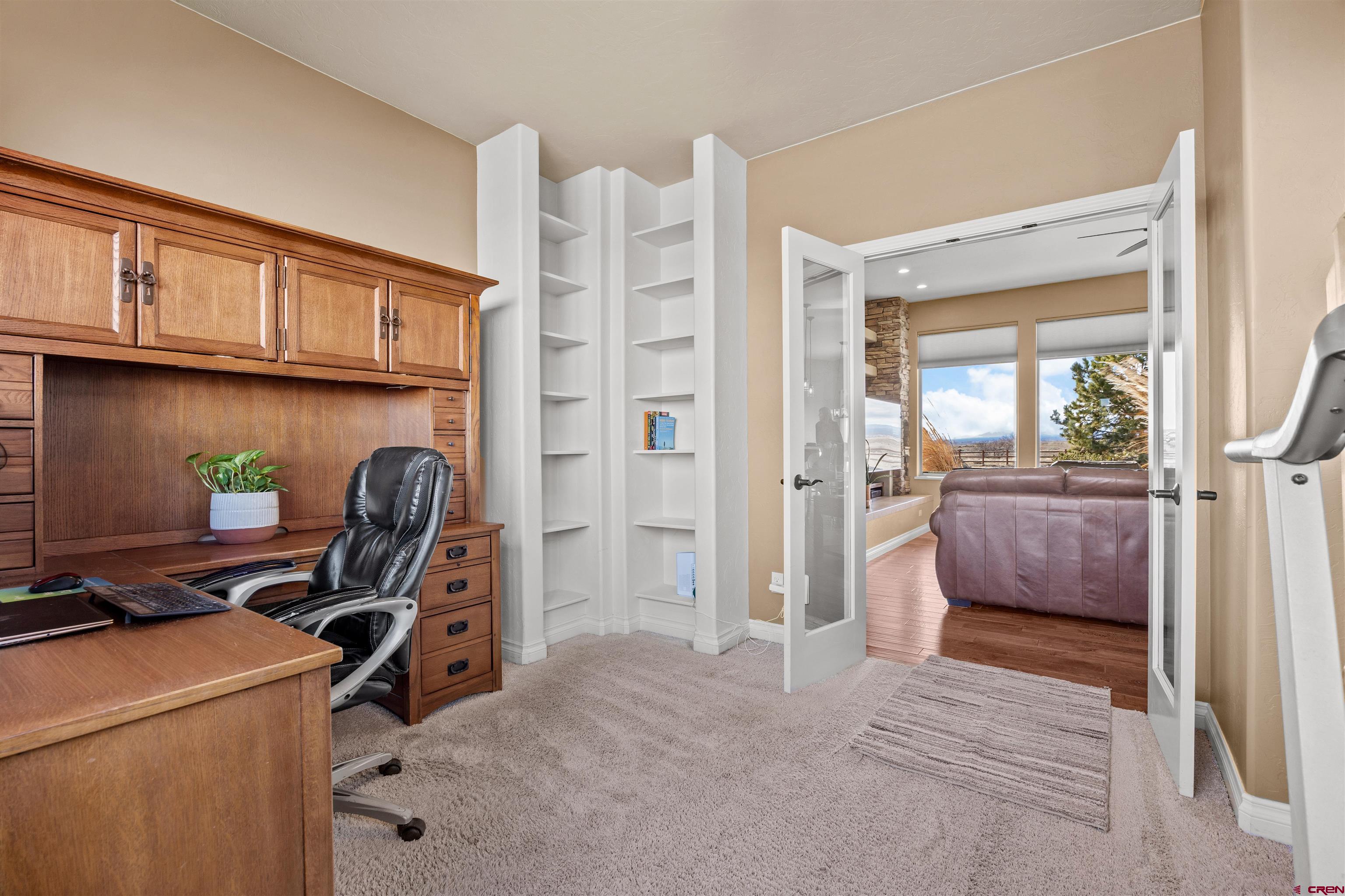 9838 5650th Road Olathe, CO 81425 - Photo 16 of 44 a workspace with furniture and a window