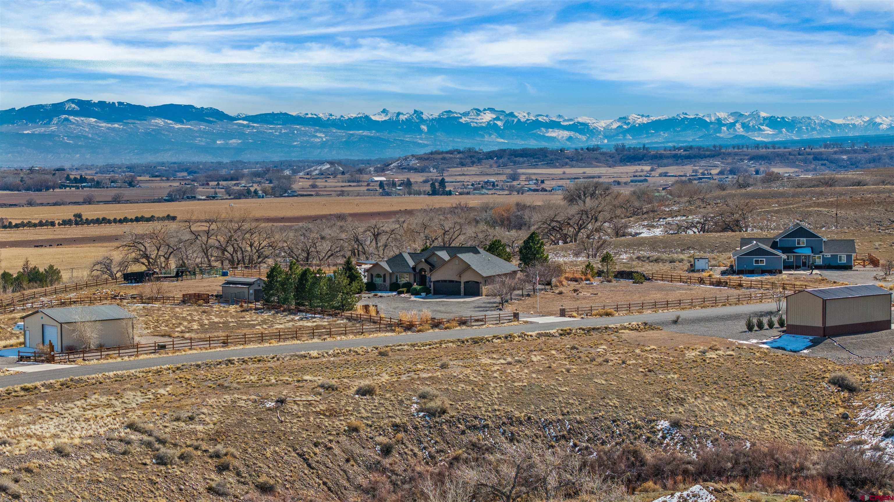 9838 5650th Road Olathe, CO 81425 - Photo 20 of 44 a view of a lake with a mountain