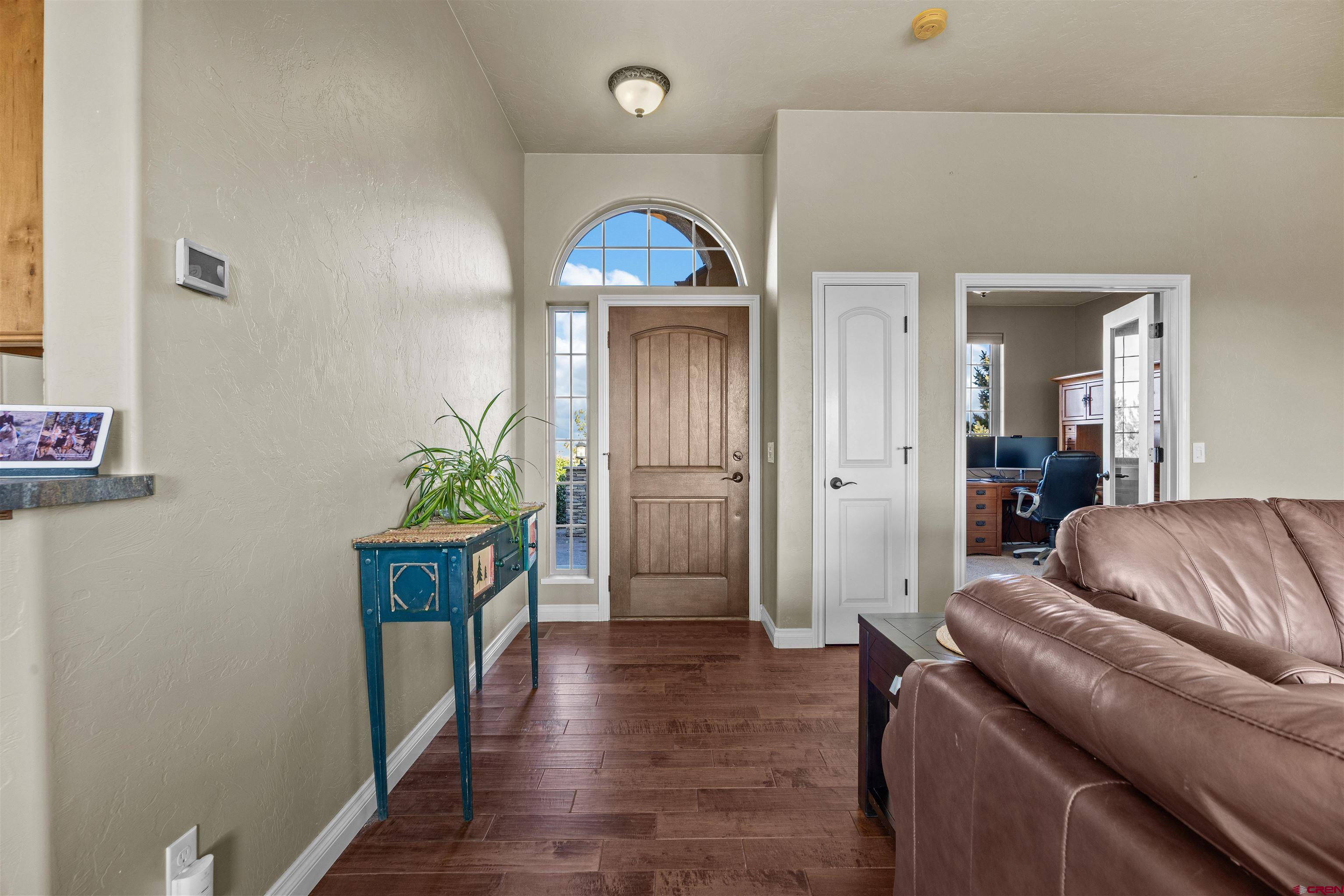 9838 5650th Road Olathe, CO 81425 - Photo 25 of 44 a living room with furniture and a wooden floor